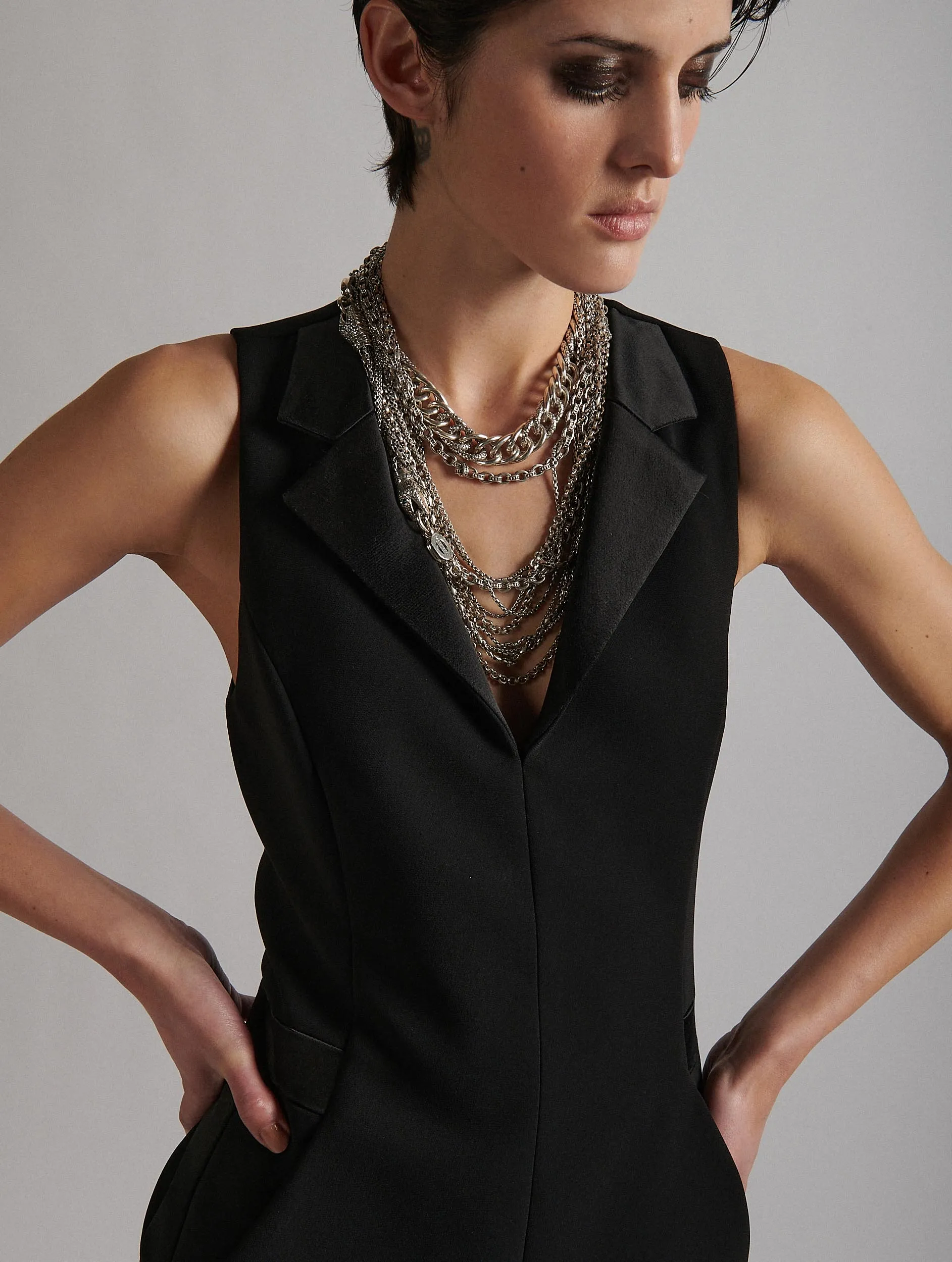 Sleeveless smoking dress in black crepe