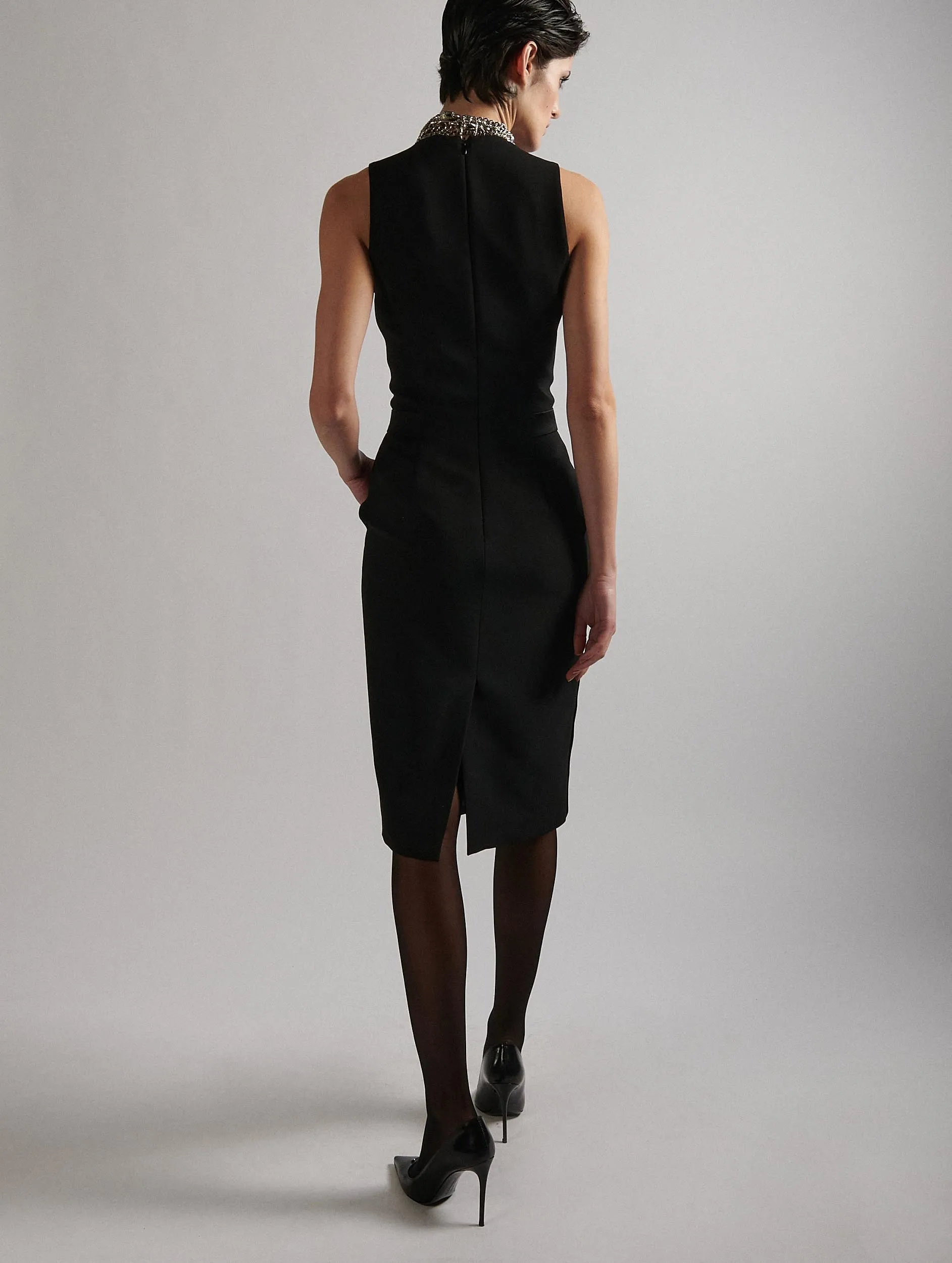 Sleeveless smoking dress in black crepe